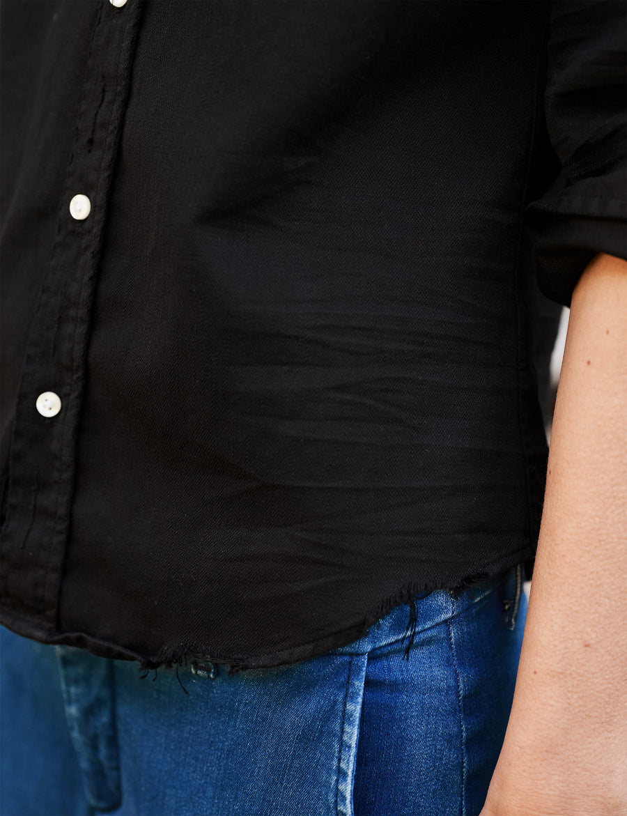 Detail of front button placket on person wearing Black Frank & Eileen Barry Tailored Button-Up Shirt in Famous Denim