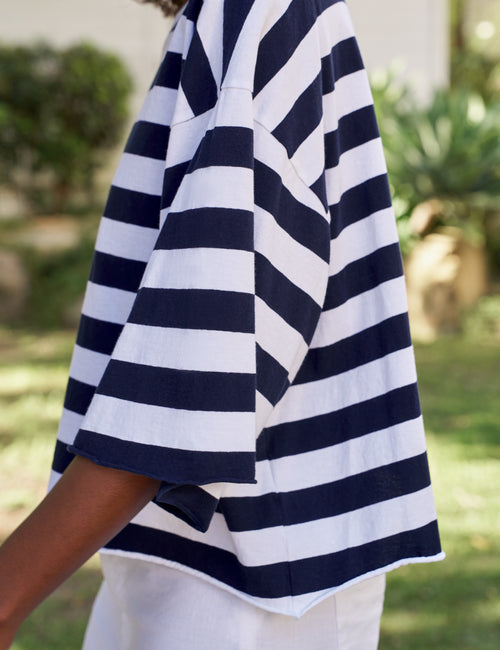 Navy and white striped shirt worn by a person outdoors, view 3