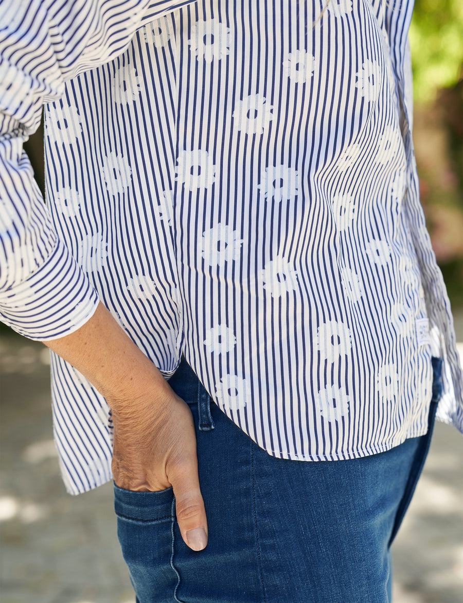 Hem detail shot of person wearing Blue Floral Frank & Eileen Silivio Untuckable Button-Up Shirt in Superluxe