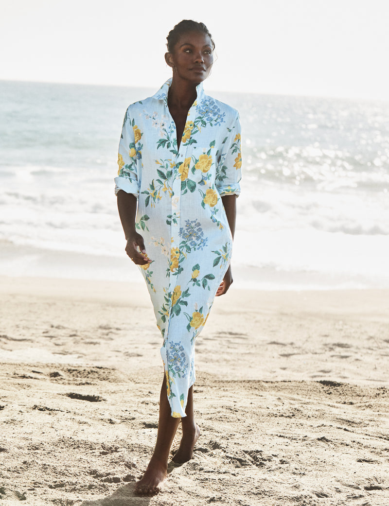 Woman wearing a floral dress on a beach