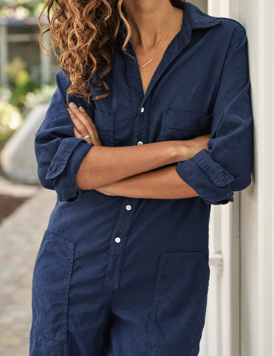 Detail of front button placket and front pockets on person wearing Navy Frank & Eileen Northern Ireland Jumpsuit in Italian Performance Linen