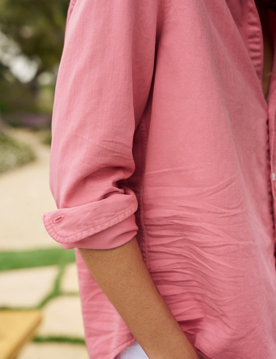 Detail of rolled up sleeve on person wearing Pink Frank & Eileen Eileen Relaxed Button-Up Shirt in Famous Denim