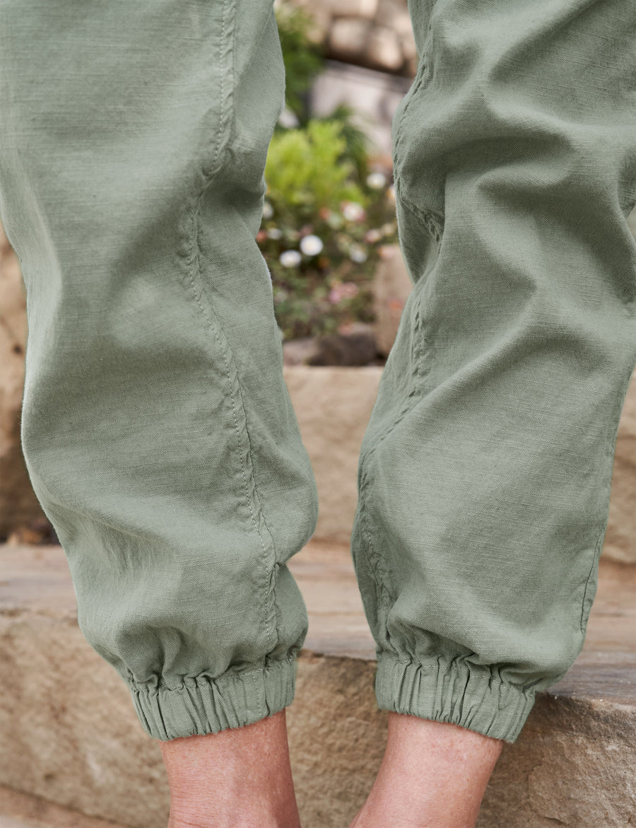 Detail of scrunched hem on person wearing Sage Green Frank & Eileen Jameson Utility Jogger in Italian Performance Linen