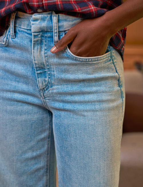 Close-up of blue jeans with a blurred background, view 3
