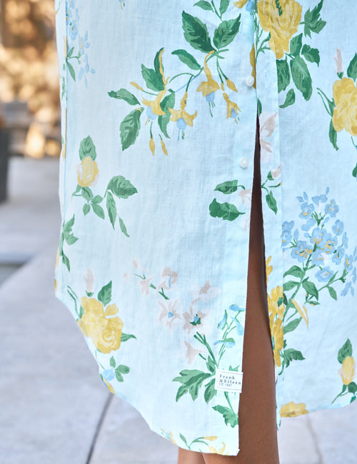Light blue dress with floral pattern worn by a person outdoors, view 4