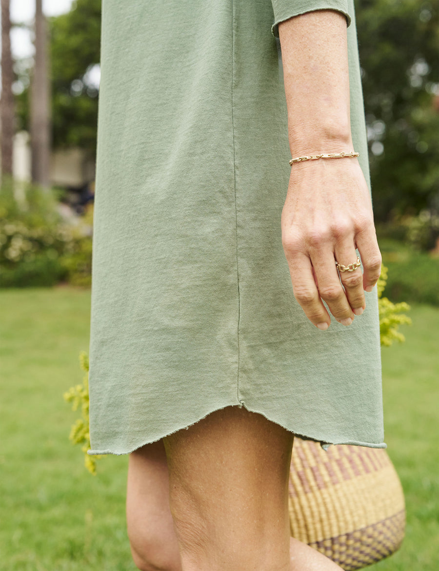 Detail of curved hem on person wearing Green Frank & Eileen Nicole Popover Henley Dress in Heritage Jersey