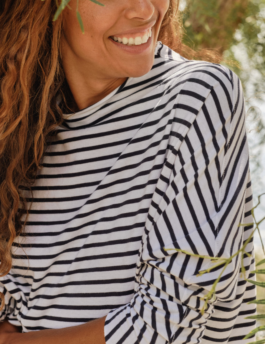 Detail of sleeve on person wearing French Stripes Frank & Eileen Effie Long-Sleeve Funnel Neck Capelet in Essential Jersey