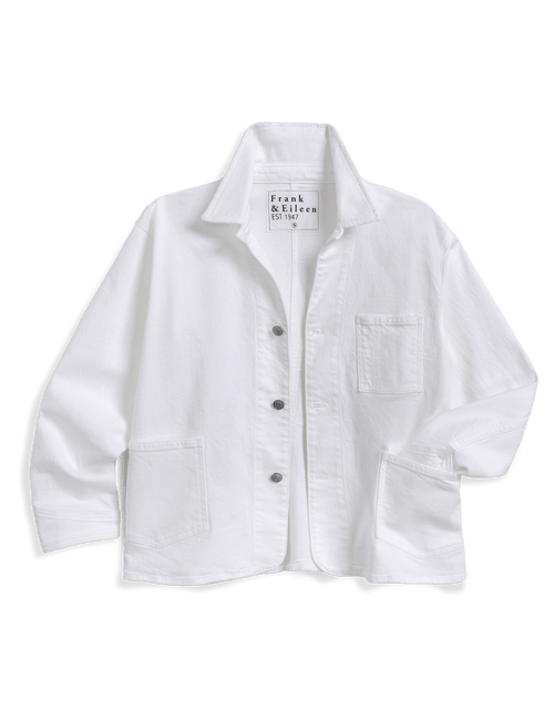 A white long-sleeve button-up shirt jacket by Frank & Eileen, featuring a pointed collar, a chest pocket, and two large front patch pockets, laid flat on a white background., front view
