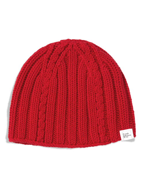 A bright red cable-knit beanie hat with a small white brand tag on the side, photographed against a clean white background., view 4