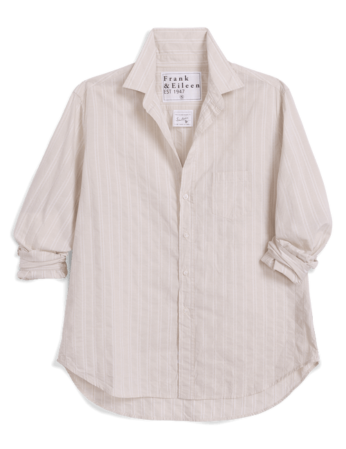 A light cream-colored long-sleeve button-up shirt with subtle vertical silver glitter pinstripes, featuring a pointed collar and rolled-up sleeves, shown against a solid black background. The brand label reads 'Frank & Eileen'., view 4