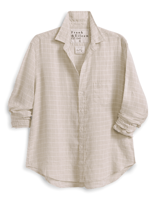 Beige button-up shirt with a brand label on a green background, front view