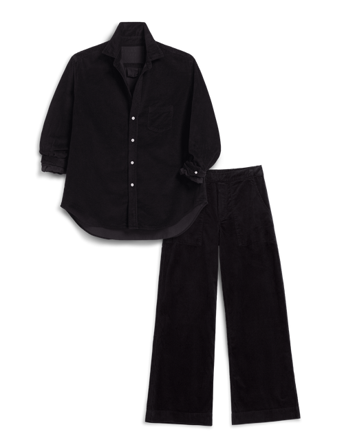 A black long-sleeve button-up shirt with a chest pocket and black corduroy pants, laid out as a flat lay on a white background., view 4