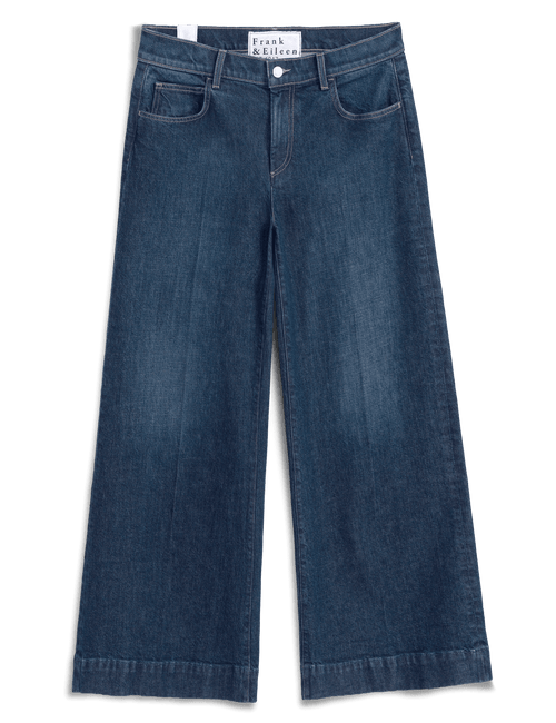 A pair of dark blue denim jeans with a straight, wide leg, shown flat against a white background. The brand name 'Frank & Eileen' is visible on the inner waistband label., view 6