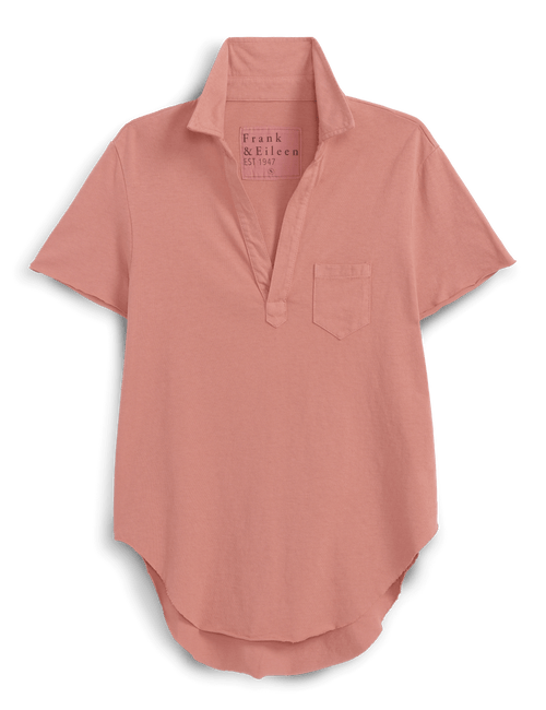 Orange short-sleeve shirt with collar on a black background, front view