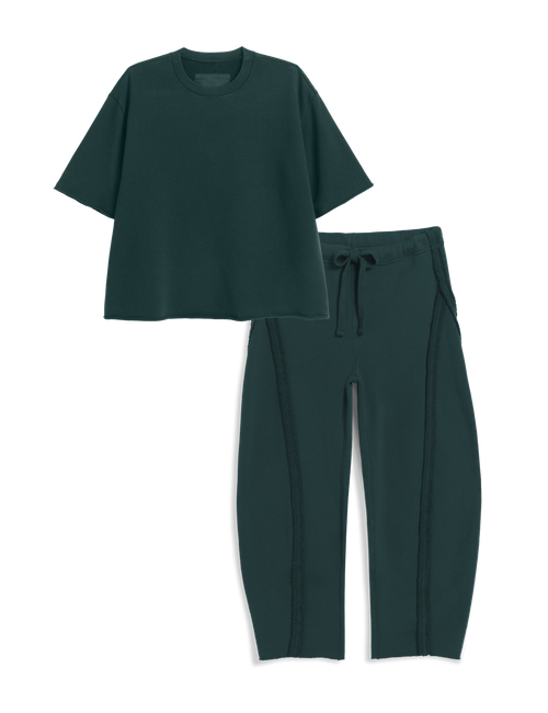 A dark green two-piece set consisting of a short-sleeve cropped t-shirt and matching drawstring sweatpants, displayed on a clean white background., view 4