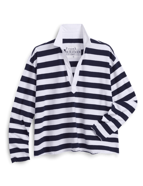 Navy and white striped shirt on a hanger with brand label against a black background, view 6