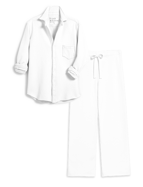 A two-piece white set consisting of a long-sleeve button-up shirt with rolled cuffs and a chest pocket, paired with matching wide-leg drawstring pants, shown on a plain white background., view 4