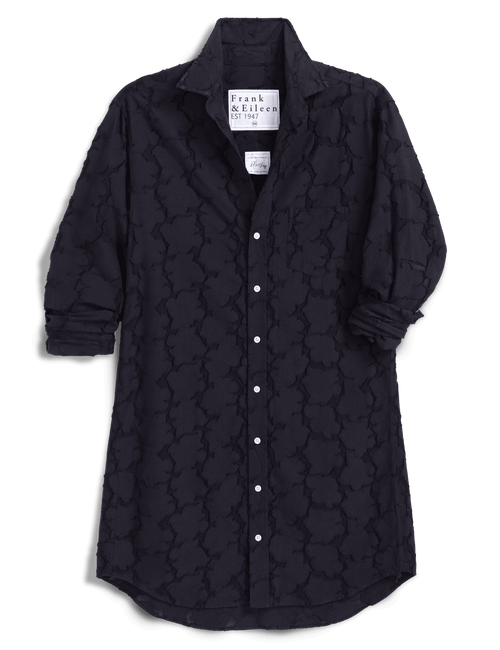 A black dress by Frank & Eileen, featuring a textured, embossed trellis pattern. The dress is shown with the sleeves rolled up, set against a solid dark green background., view 4