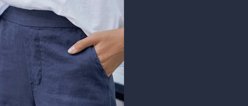 Woman wearing navy linen pants.