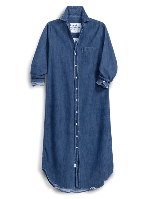 A blue denim shirt dress with a pointed collar, button-down front, and rolled cuffs, shown against a solid green background., view 6