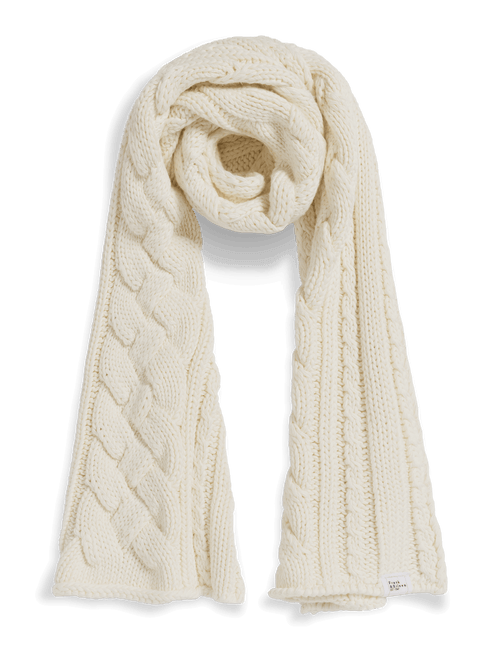 An off-white cable-knit scarf with a twisted center, styled in a loop on a clean white background., front view