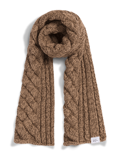 A chunky cable-knit scarf in a warm camel brown color, styled in a loop with the ends hanging down, on a clean white background., front view