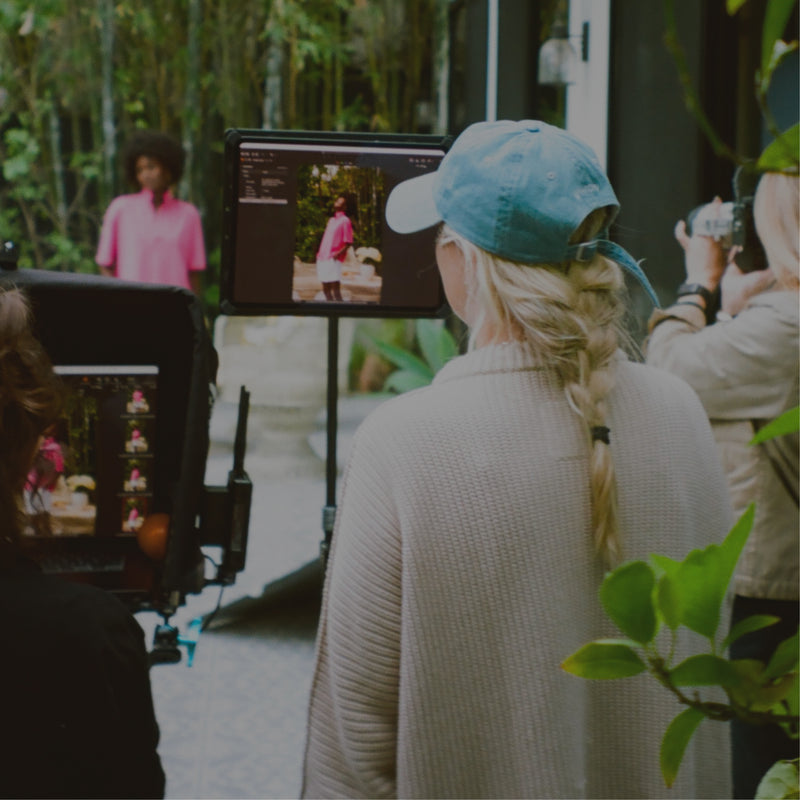 Film crew on a set with monitors and equipment