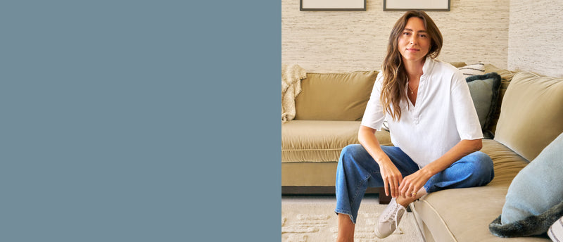 Woman sitting on a couch in a living room