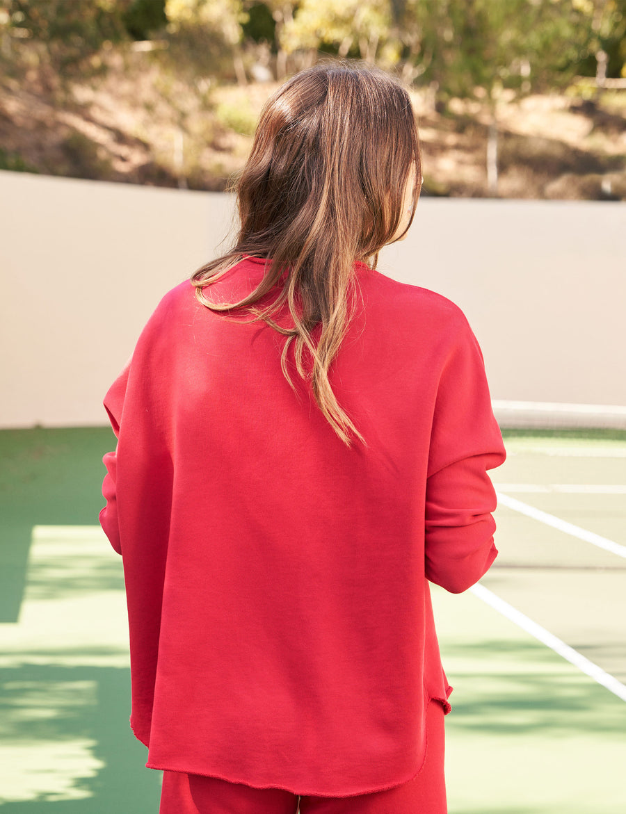 Back shot of person wearing Red Frank & Eileen Anna Long-Sleeve Capelet in Triple Fleece